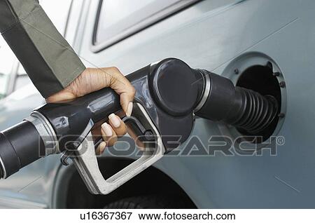 Woman pumping gas, close up of hand View Large Photo Image Stock Photo - Woman pumping gas, close up of hand. Fotosearch