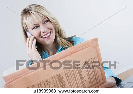 Woman Reading Stock Listings in Newspaper View Large Photo Image Stock Image - Woman Reading Stock Listings in Newspaper. Fotosearch