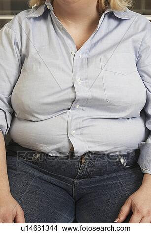 Picture - Woman sitting, mid section. Fotosearch