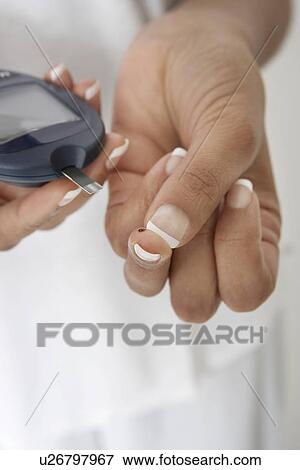 Woman taking diabetes test, close-up of hands View Large Photo Image Stock Photo - Woman taking diabetes test, close-up of hands. Fotosearch