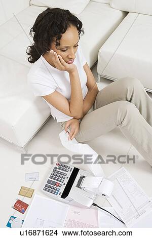 Picture - Woman Unhappy About Finances. Fotosearch