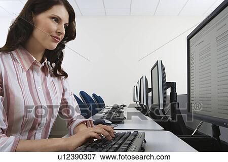 Woman using computer View Large Photo Image Stock Photo - Woman using computer. Fotosearch