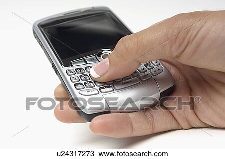 Woman using PDA, close-up of hand View Large Photo Image Stock Image - Woman using PDA, close-up of hand. Fotosearch