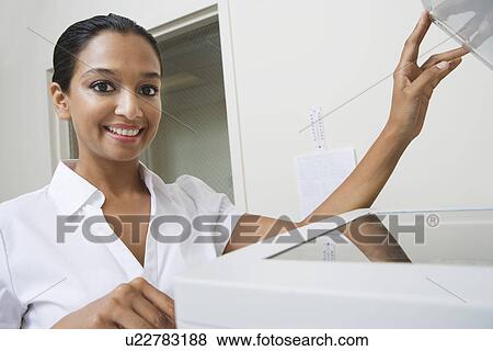 Woman Using Photocopier View Large Photo Image Stock Photo - Woman Using Photocopier. Fotosearch
