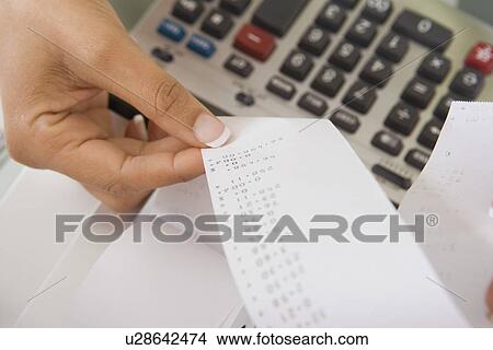Picture - Woman with Adding Machine Tape. Fotosearch