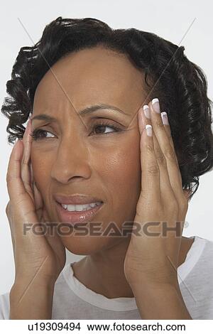 Picture - Woman with head in hands, close-up. Fotosearch