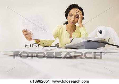 Woman Working on Bills View Large Photo Image Stock Image - Woman Working on Bills. Fotosearch