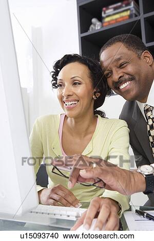 Stock Image - Woman Working with Accountant. Fotosearch