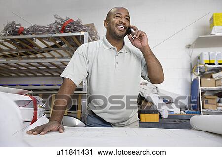 Workman Talking on Cell Phone View Large Photo Image Stock Image - Workman Talking on Cell Phone. Fotosearch