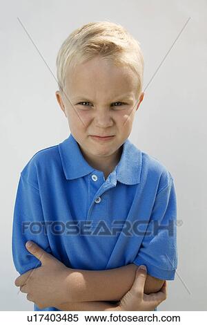 Stock Photography - Young Boy Glaring. Fotosearch