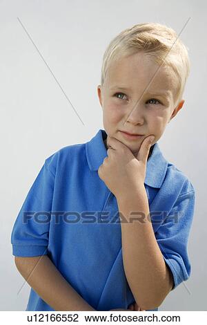 Stock Image - Young Boy Thinking. Fotosearch