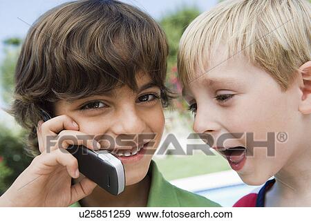 Young Boys Using Cell Phone View Large Photo Image Stock Photo - Young Boys Using Cell Phone. Fotosearch