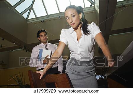 Young business people in office View Large Photo Image Stock Photo - Young business people in office. Fotosearch