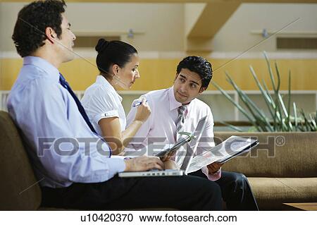 Young business people working in office View Large Photo Image Stock Image - Young business people working in office. Fotosearch