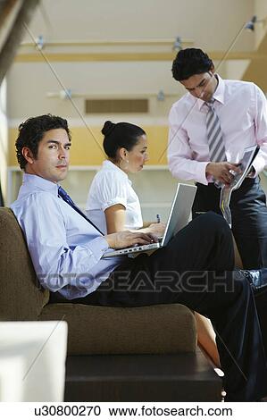 Young business people working in office View Large Photo Image Stock Image - Young business people working in office. Fotosearch