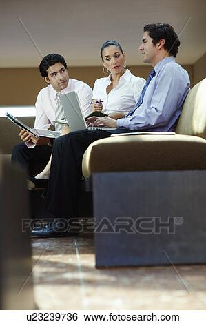 Young business people working in office View Large Photo Image Stock Photograph - Young business people working in office. Fotosearch