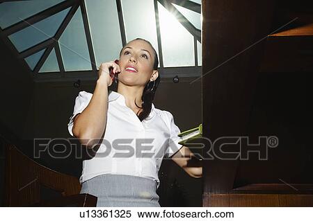 Young business woman on the phone View Large Photo Image Stock Photography - Young business woman on the phone. Fotosearch