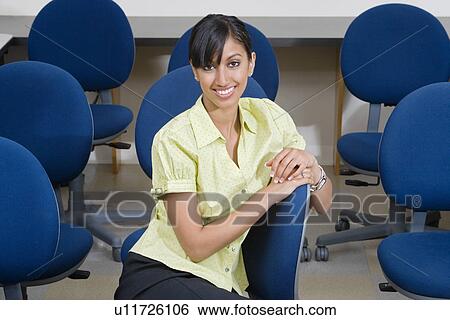 Young Businesswoman Sitting in Chair View Large Photo Image Stock Photograph - Young Businesswoman Sitting in Chair. Fotosearch