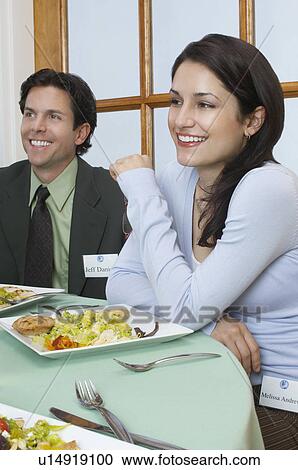 Young couple at restaurant table View Large Photo Image Stock Image - Young couple at restaurant table. Fotosearch