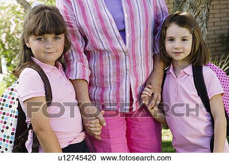Young Daughters Holding Hands with Mother View Large Photo Image Stock Image - Young Daughters Holding Hands with Mother. Fotosearch