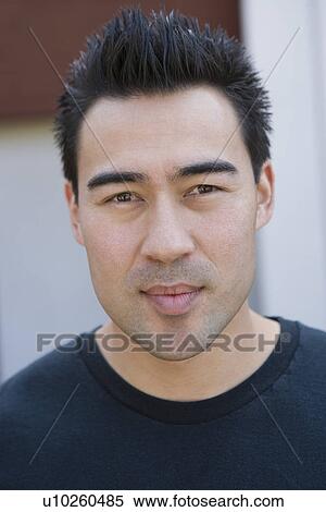 Stock Photography - Young man outdoors, portrait. Fotosearch