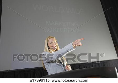 Young woman having presentation at conference View Large Photo Image Stock Photography - Young woman having presentation at conference. Fotosearch