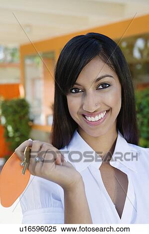 Young Woman Holding a Set of Keys View Large Photo Image Stock Photography - Young Woman Holding a Set of Keys. Fotosearch
