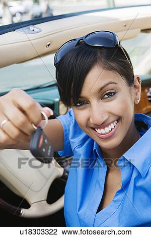 Young Woman Holding Car Keys View Large Photo Image Stock Image - Young Woman Holding Car Keys. Fotosearch