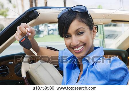 Young Woman Holding Key to Convertible View Large Photo Image Stock Image - Young Woman Holding Key to Convertible. Fotosearch