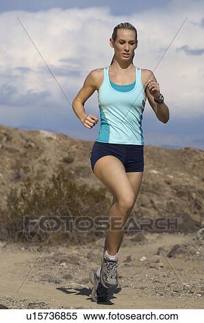Young woman jogging in mountains View Large Photo Image Stock Photography - Young woman jogging in mountains. Fotosearch