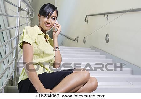 Stock Photo - Young Woman Talking on Cell Phone. Fotosearch