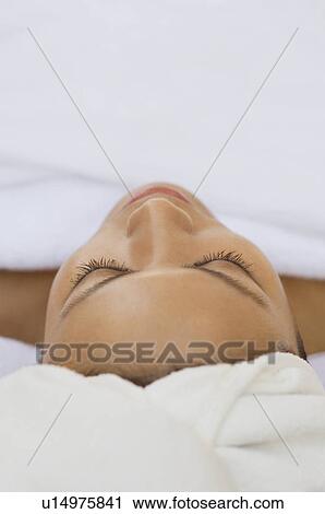 Young woman wearing towel turban, close-up View Large Photo Image Stock Image - Young woman wearing towel turban, close-up. Fotosearch