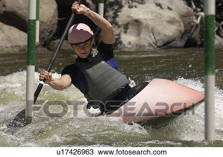 Young woman whitewater kayaking View Large Photo Image Stock Image - Young woman whitewater kayaking. Fotosearch