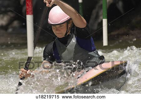 Young woman whitewater kayaking View Large Photo Image Stock Photography - Young woman whitewater kayaking. Fotosearch