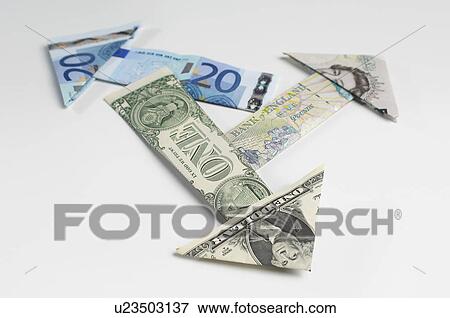 Stock Photo - Arrows made of folded banknotes. Fotosearch