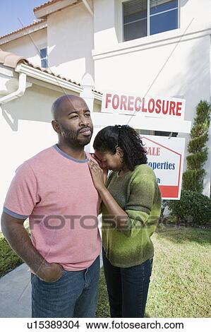 Picture - Bankrupt couple moving out of house. Fotosearch
