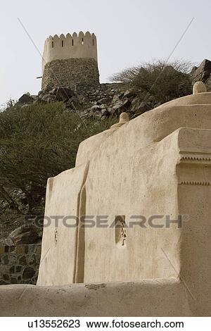 Stock Image - Bidyah, UAE, two watchtowers overlooking Al Bidyah Mosque built in 1446. Fotosearch