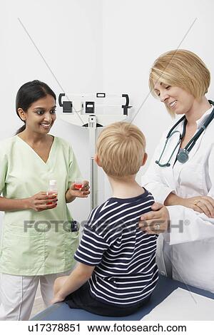 Boy being examined View Large Photo Image Stock Image - Boy being examined. Fotosearch