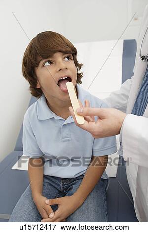 Stock Photo - Boy having medical examination. Fotosearch