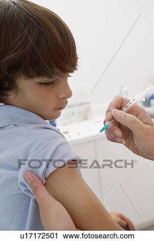 Boy receiving injection, close-up View Large Photo Image Stock Image - Boy receiving injection, close-up. Fotosearch