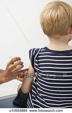 Picture - Boy receiving injection. Fotosearch