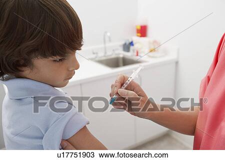 Boy receiving injection View Large Photo Image Stock Image - Boy receiving injection. Fotosearch