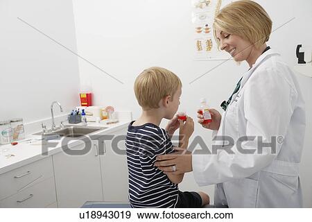 Boy taking medicine View Large Photo Image Stock Photo - Boy taking medicine. Fotosearch