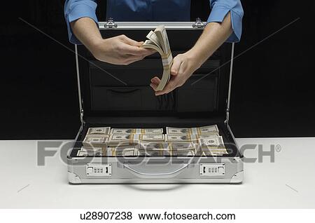 Stock Photo - Briefcase Full of Money. Fotosearch