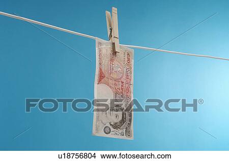 British paper currency on clothesline View Large Photo Image Picture - British paper currency on clothesline. Fotosearch