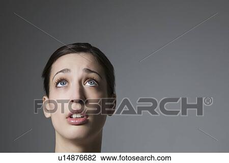 Brunette with blue eyes looking up View Large Photo Image Stock Image - Brunette with blue eyes looking up. Fotosearch