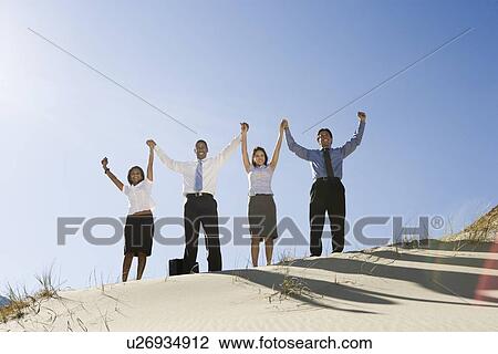 Business People Cheering in the Desert View Large Photo Image Stock Image - Business People Cheering in the Desert. Fotosearch
