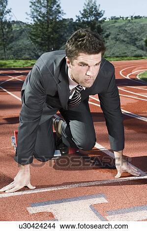 Picture - Businessman At Starting Blocks. Fotosearch