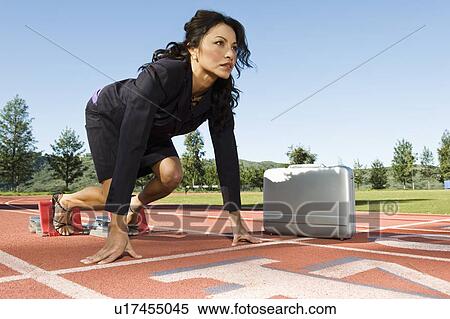 Stock Photography - Businesswoman At Starting Blocks. Fotosearch