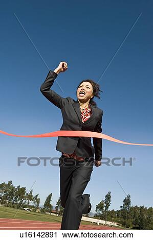 Businesswoman Crossing the Winning Line View Large Photo Image Stock Image - Businesswoman Crossing the Winning Line. Fotosearch